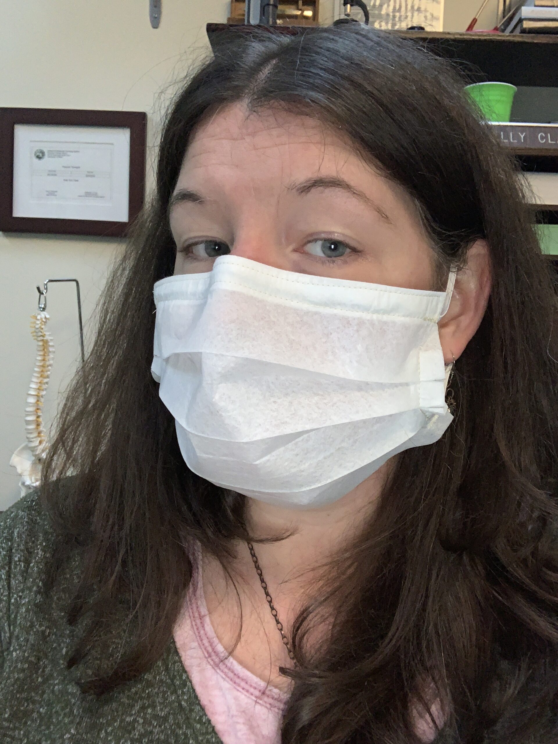 Photo of Dr. Kelly Clark wearing a fabric facemask